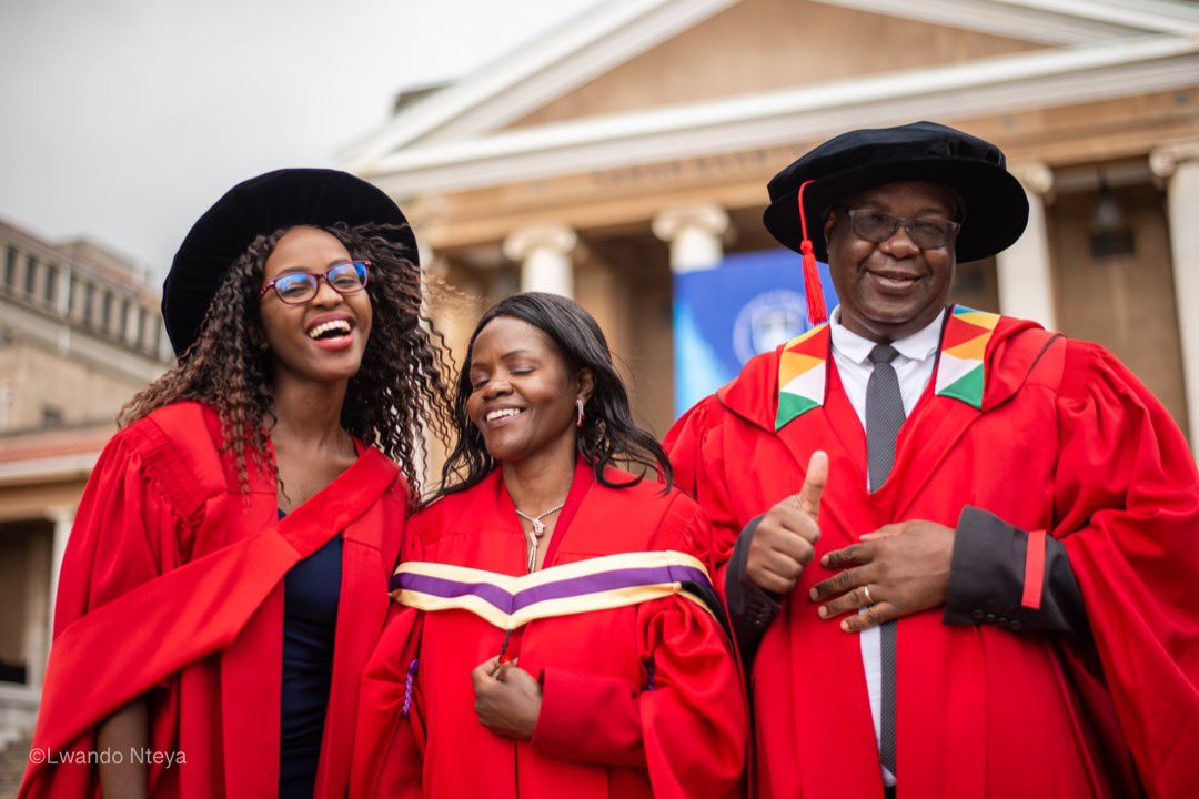 Pictures! The inspiring story of a mother, father, and daughter who graduated with the Ph.D. same year