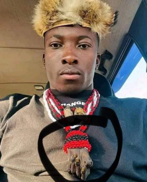 A man hanging an alleged dried human hand on his neck stirs up debate